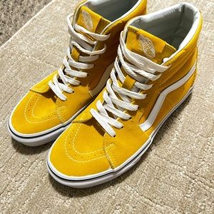 Yellow high top Vans tennis shoes